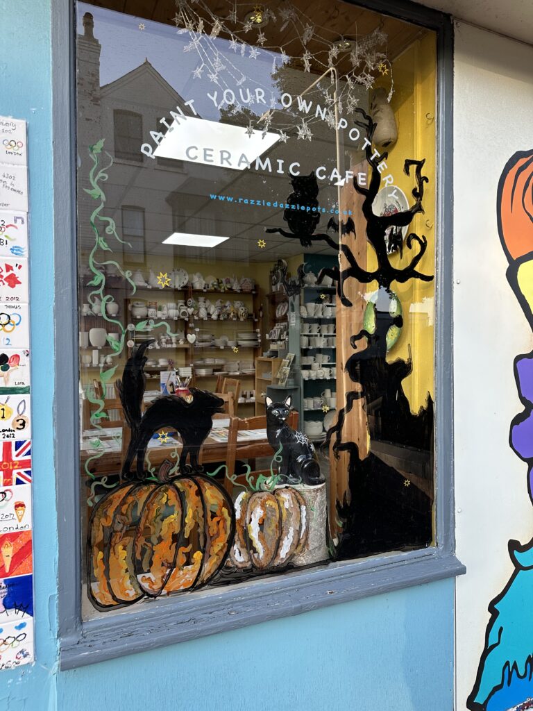 Awesome Halloween themed window display for pottery painting studio in Nottingham